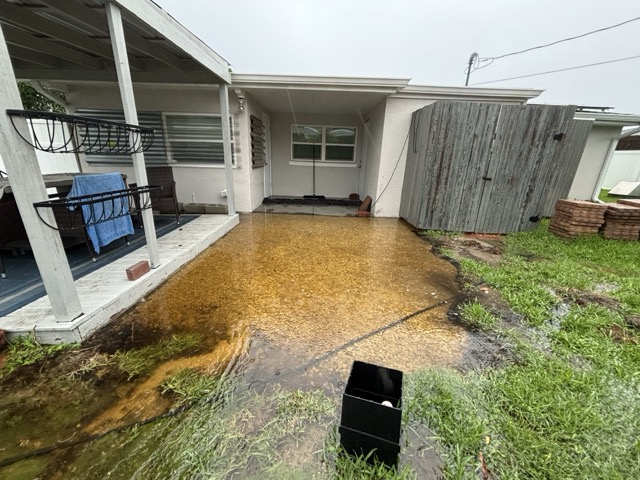 Floodwater collecting against a South Venice Florida home during heavy rain